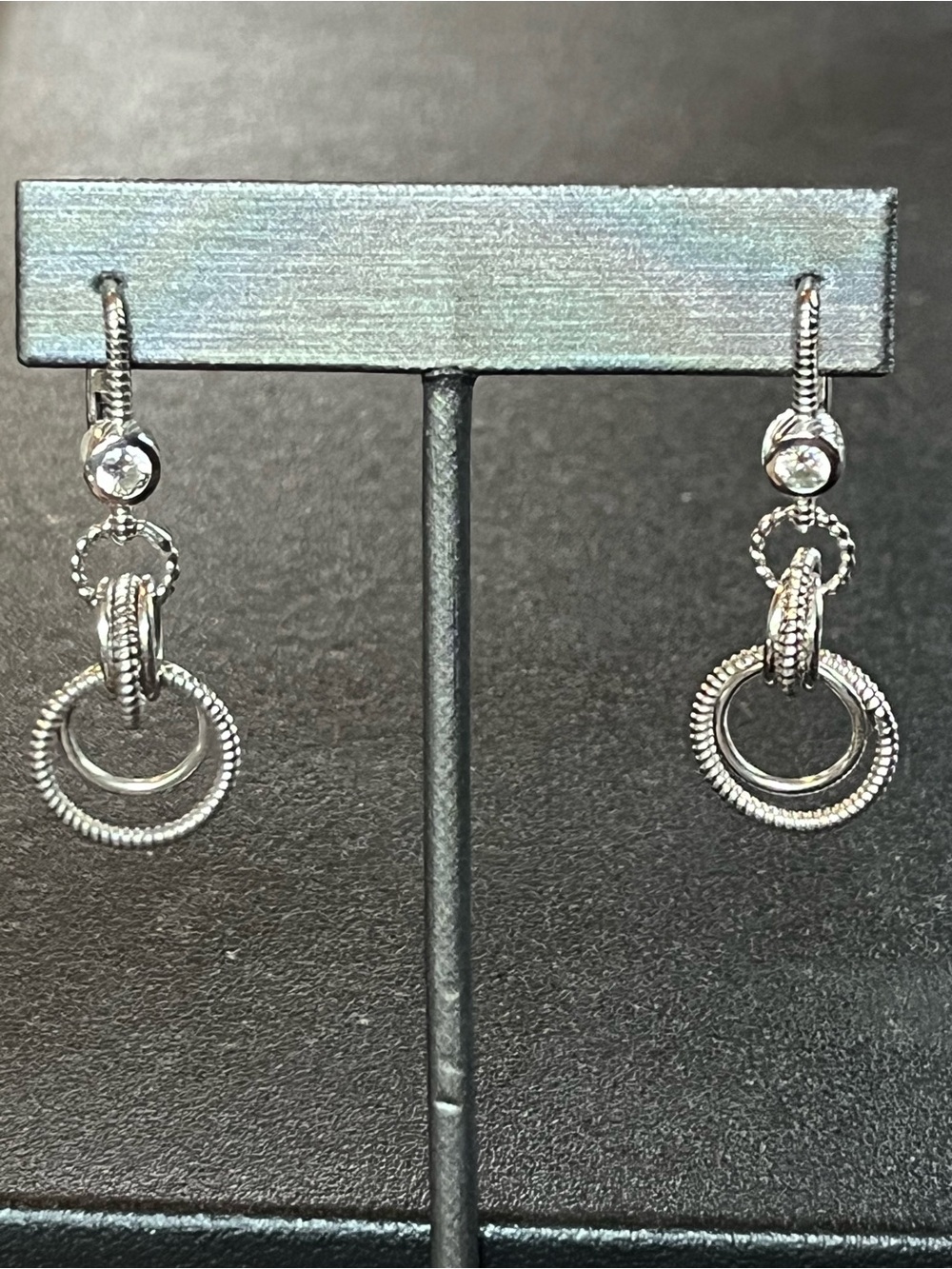 Judith Ripka Sterling silver dangle circular earrings w cz’s.
